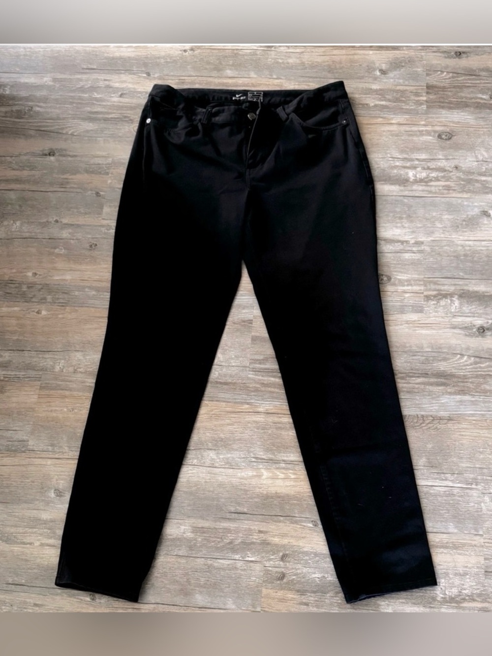 Nike Dri-FIT black athletic pants.